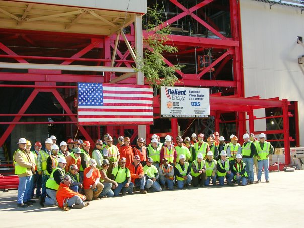 Picture of construction crew & mgt after last steel piece is placed. 